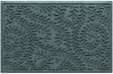 WaterHog Boxwood Front Door Mat ridge design close-up captures dirt at the threshold