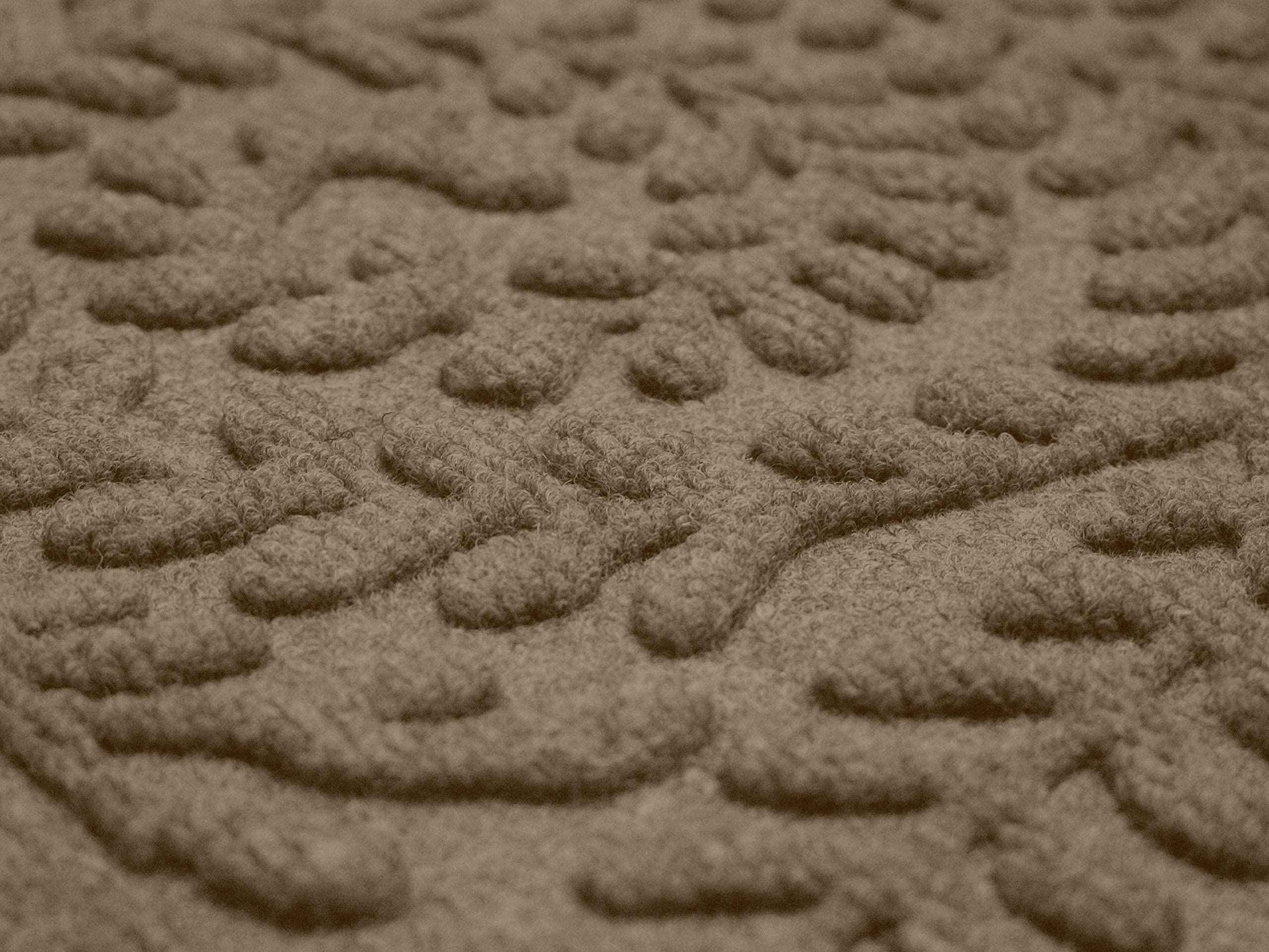 WaterHog Boxwood outdoor mat demonstrates all-weather durability in a doorway setting.