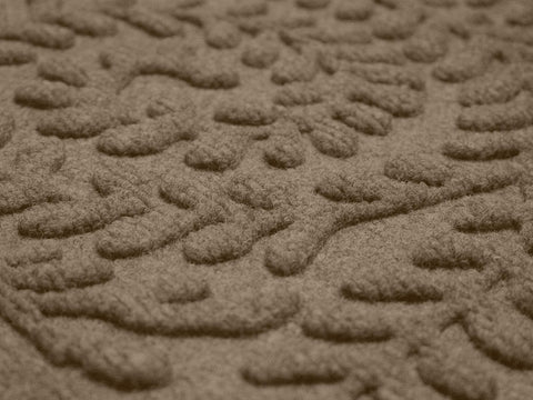 WaterHog Boxwood outdoor mat demonstrates all-weather durability in a doorway setting.