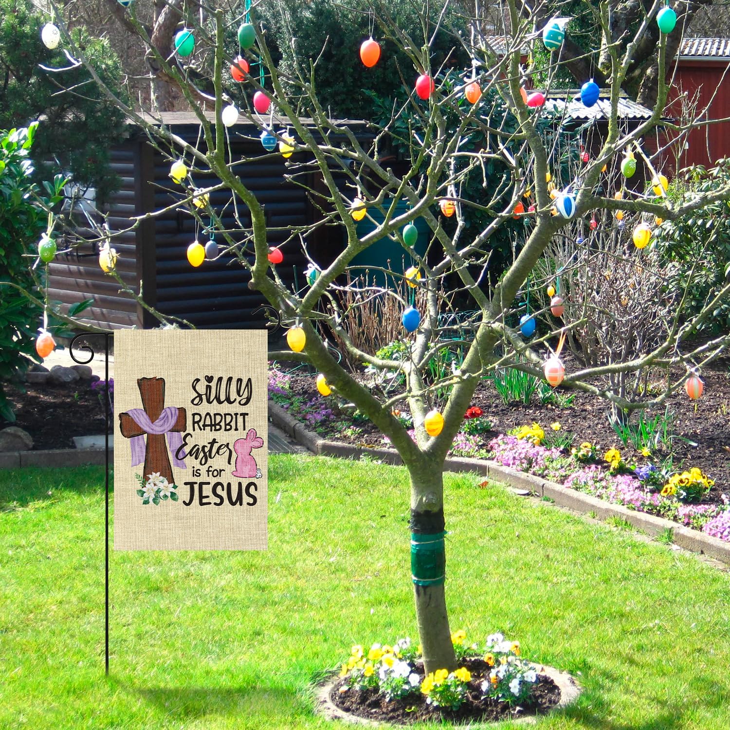 Easter party decor flag by WATINC displayed in a garden or yard