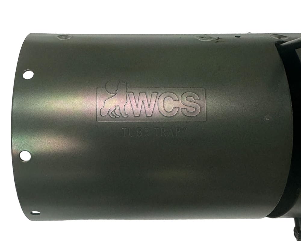 WCS Tube Trap in-use image shows baited setup for attracting squirrels near feeders.