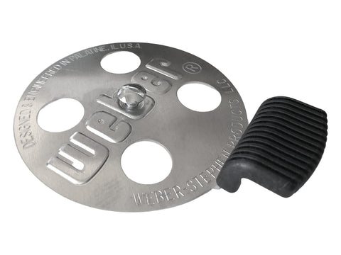 Weber Bar-B-Kettle damper kit closeup showing vent holes for airflow control.