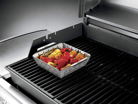 Weber vegetable basket used for side-dish veggies beside main entrée