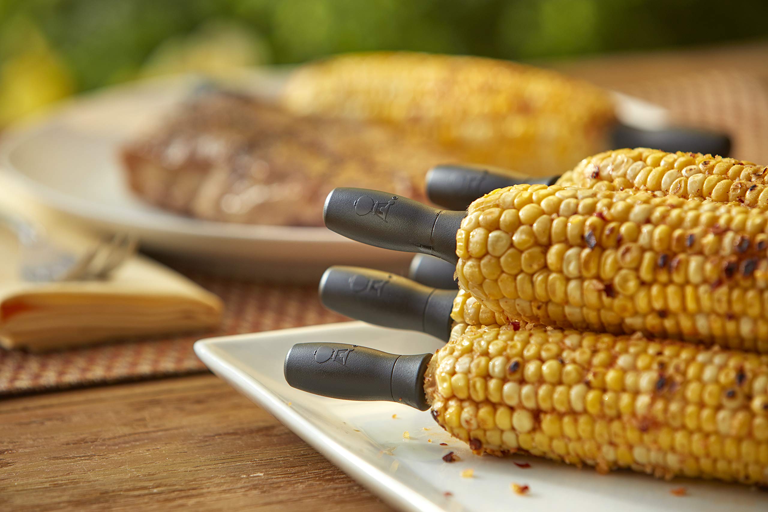 Clear plastic storage case keeps Weber corn picks organized.