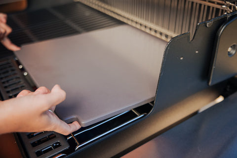 Weber Crafted cordierite stone with even heat distribution for consistent baking.
