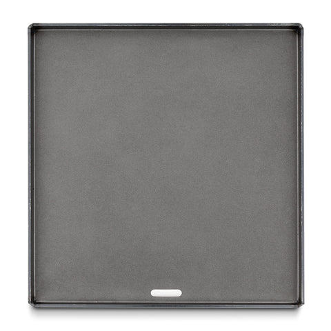 Weber Crafted flat-top griddle rim edge keeps oil and seasonings in place.