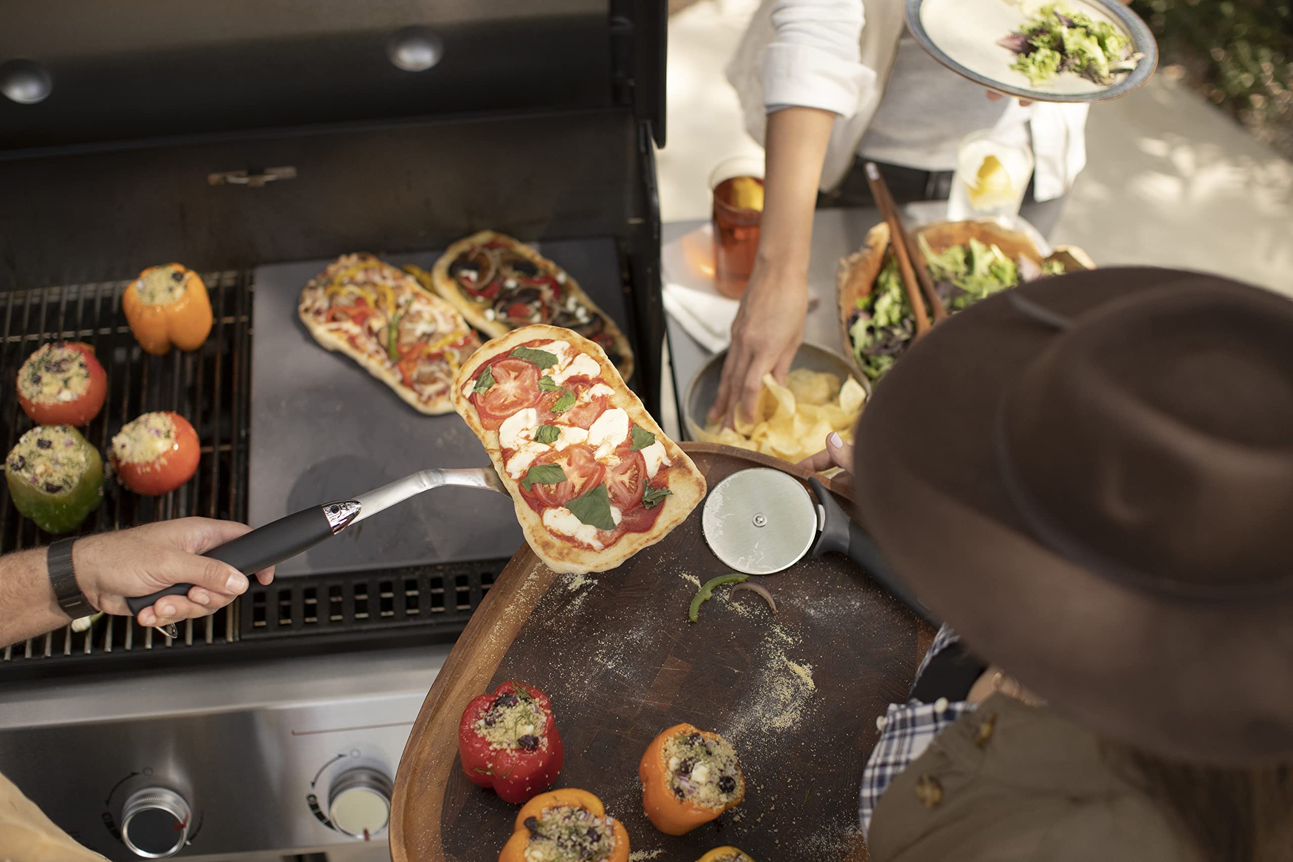 Weber Crafted frame with Weber Crafted grillware illustrates modular outdoor cooking setup.