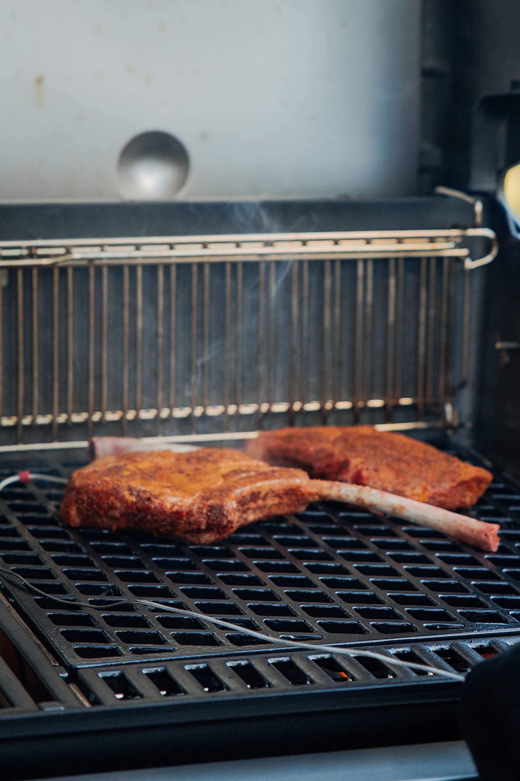 Weber Crafted Genesis bake-and-sear frame demonstrates versatile outdoor meal prep.