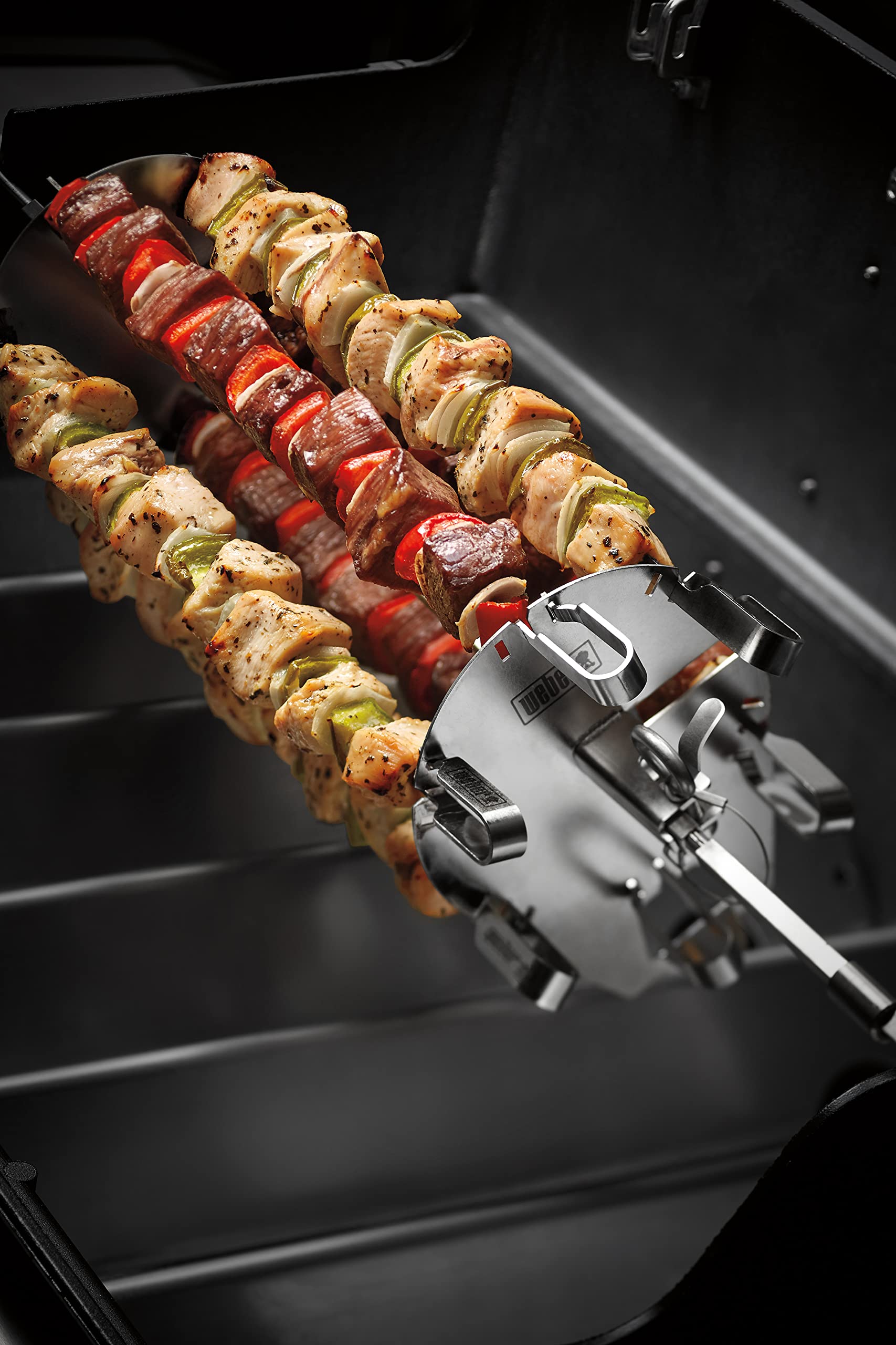 Weber Crafted Rotisserie Skewers attach to the spit for quick kebab setup.