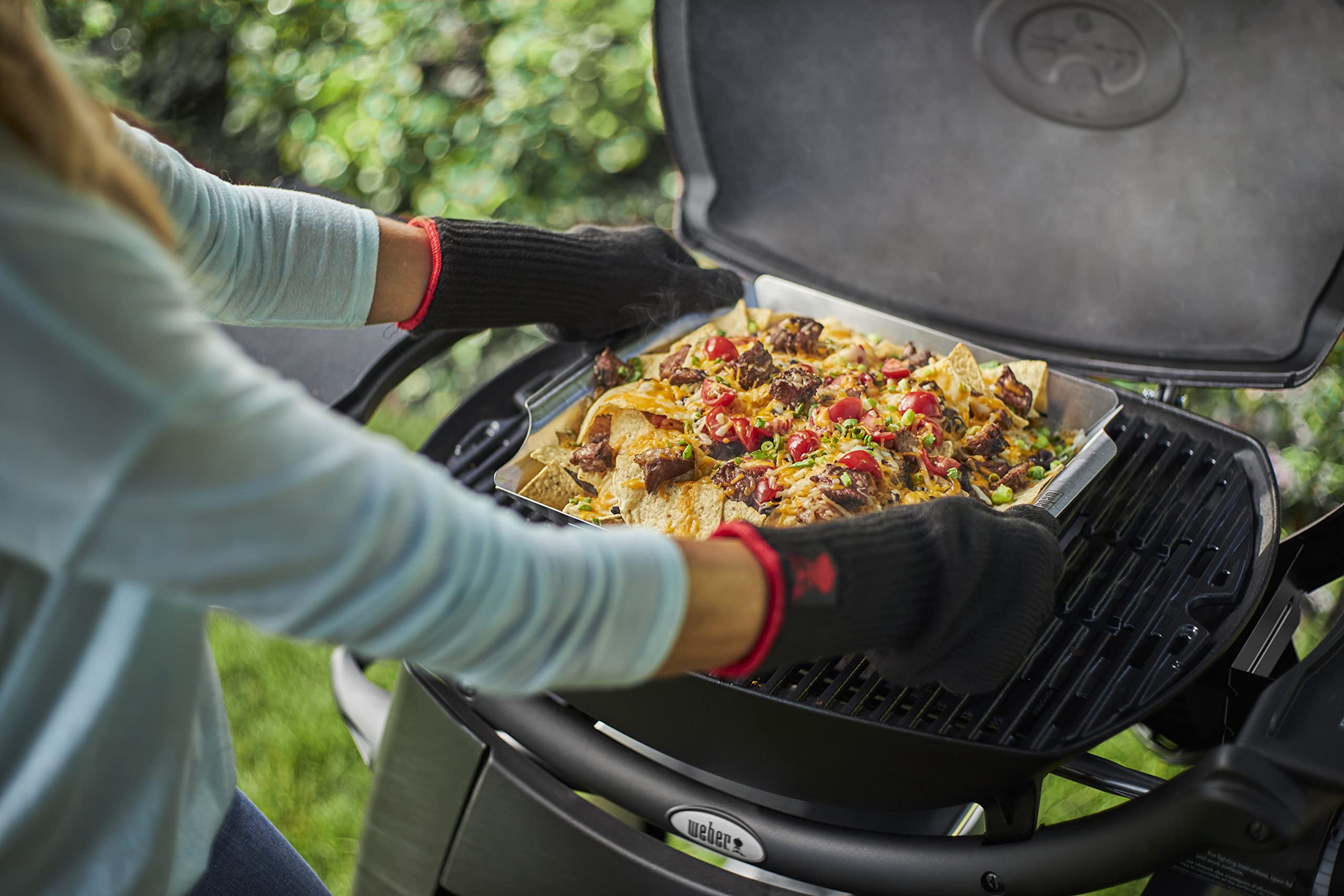 Weber Deluxe Grilling Basket charcoal grill compatibility enables even cooking.