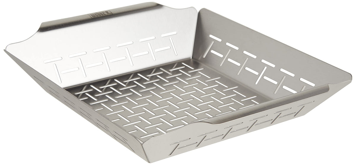 Weber Deluxe Grilling Basket vegetables for even grilling on larger Weber grills.