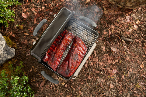 Weber Go-Anywhere camping-tailgating setup shows versatile outdoor cooking.