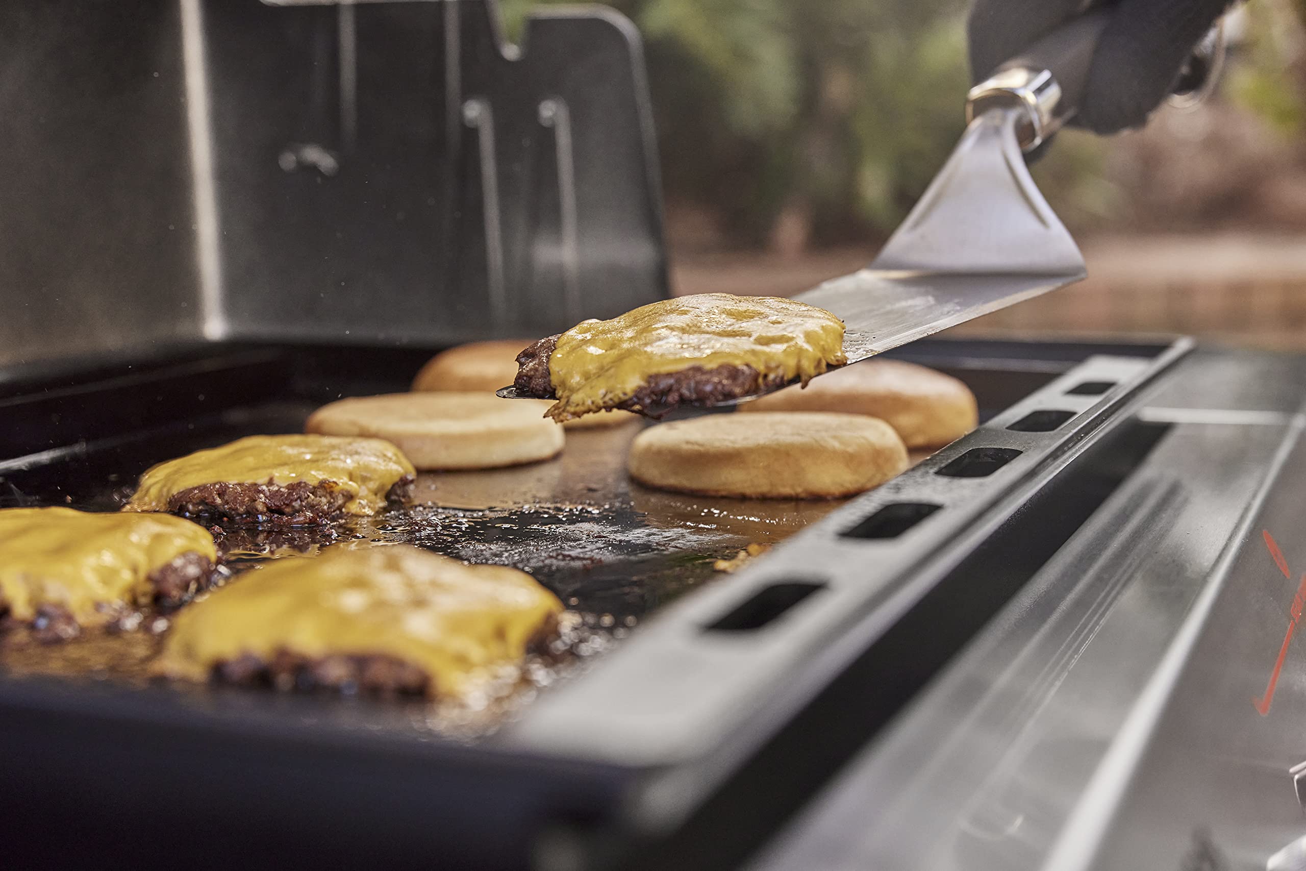 Weber griddle insert thick carbon steel resists warping during busy cookouts