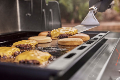 Weber griddle insert thick carbon steel resists warping during busy cookouts