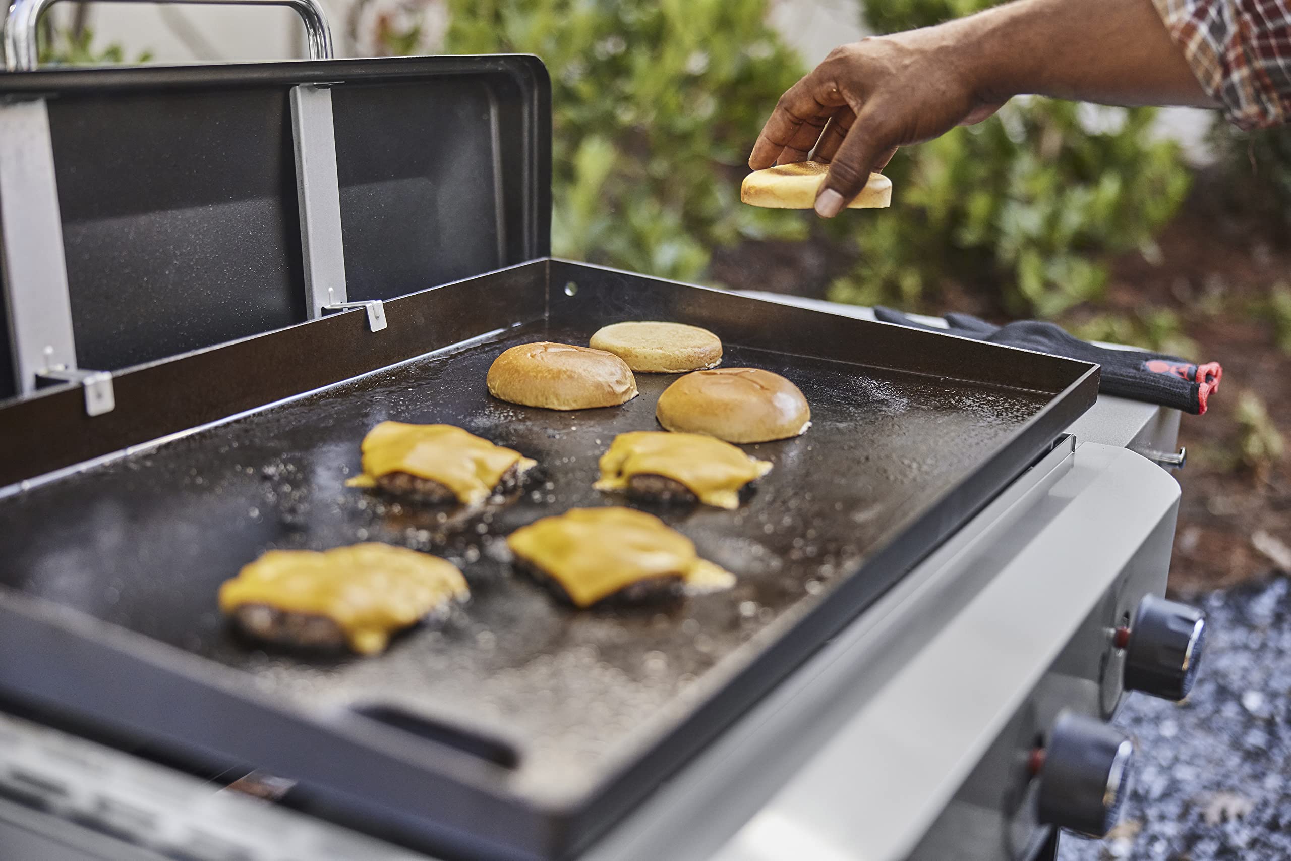 Weber Griddle Press dimensions displayed beside a griddle for size reference.