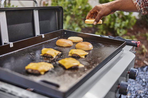 Weber Griddle Press dimensions displayed beside a griddle for size reference.