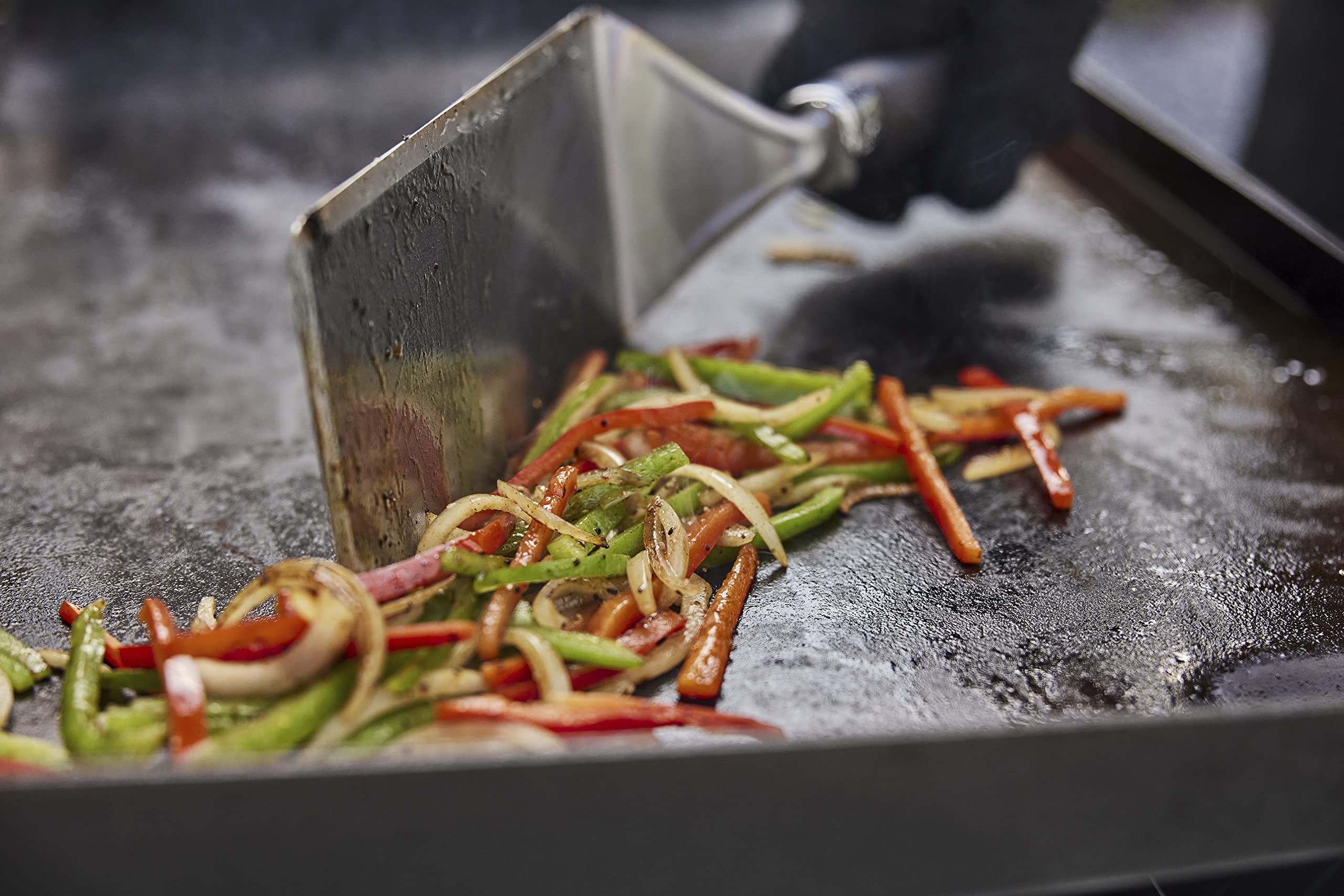 Weber Griddle Scraper removes grease after searing