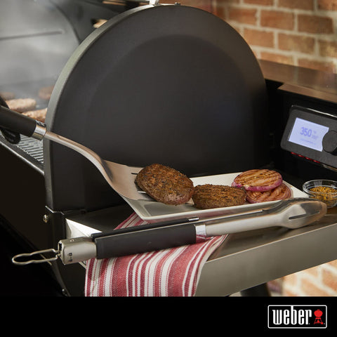 Weber hands-free locking tongs securely grip delicate foods