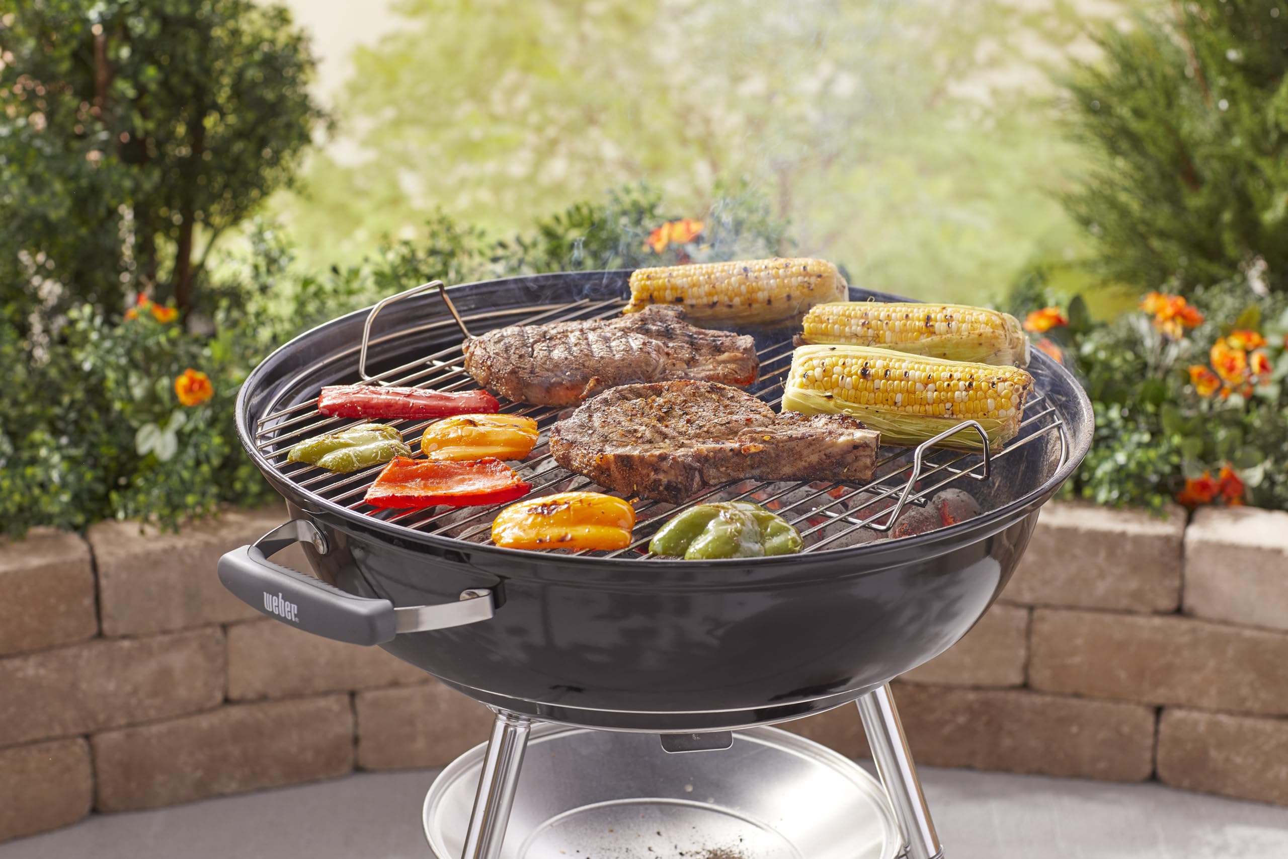 Weber Jumbo Joe portable design with all-weather wheels for easy moves