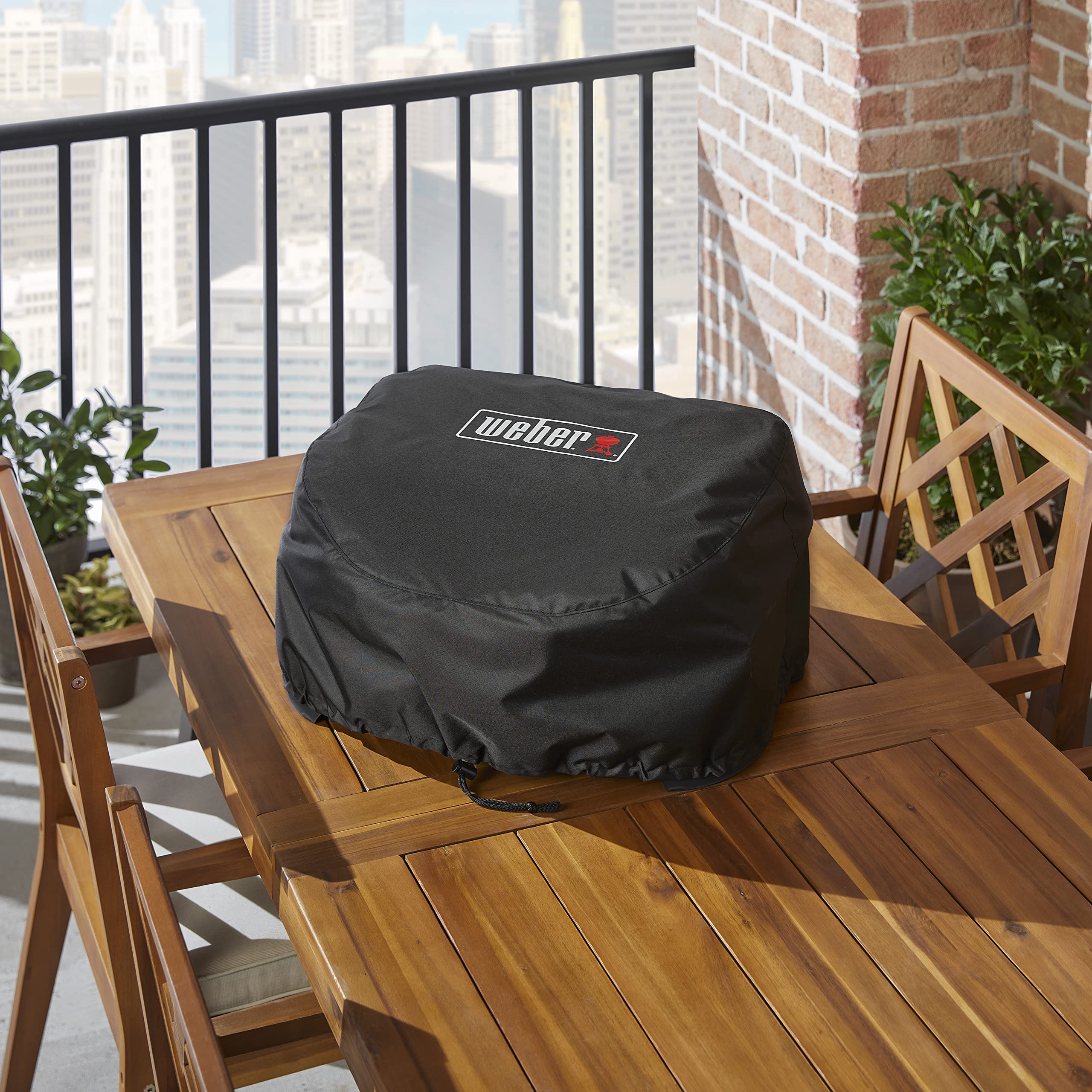 Weber Lumin cover drawstrings close-up showing secure adjustable fit.