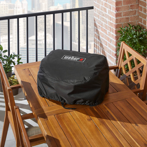 Weber Lumin cover drawstrings close-up showing secure adjustable fit.