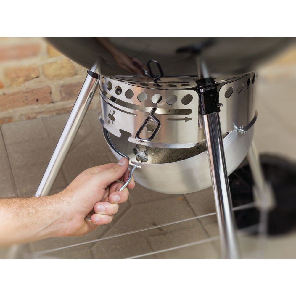 Weber Original Kettle Premium 22-inch green ash catcher enables easy cleanup.