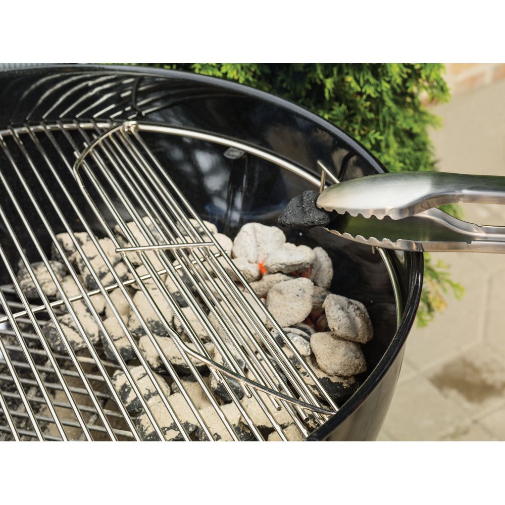 Weber Original Kettle Premium 22-inch green lid open showing charcoal access.