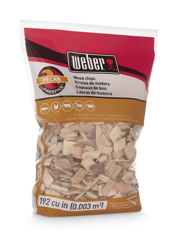 Weber Pecan Wood Chips pouring into grill for flavor