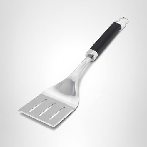 Weber spatula in action flipping burgers on a hot grill