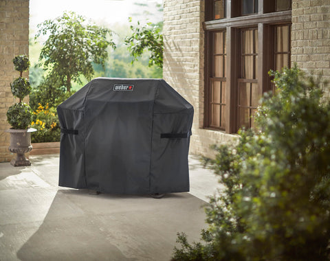 Spot clean only to maintain Weber grill cover appearance across seasons.