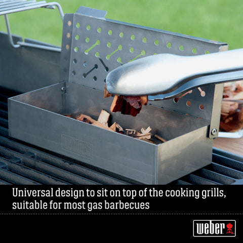 Weber Smoker Box on a large grill demonstrates compatibility.