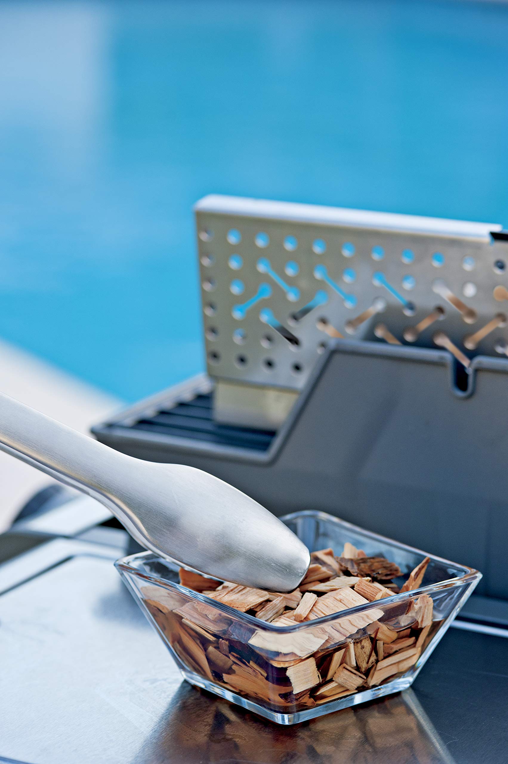 Weber Premium Smoker Box hinged lid for easy chip refills.