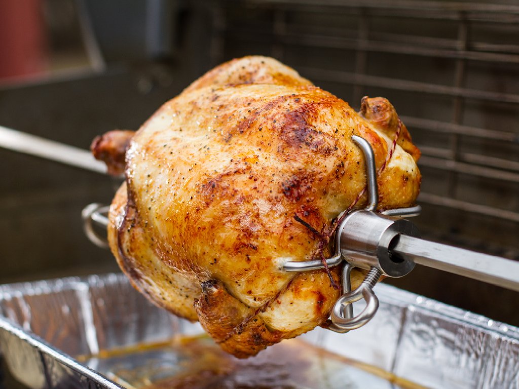 Weber rotisserie ribs on grill showcases versatile roasting options.