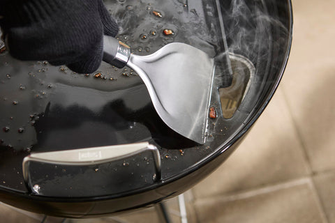 Weber round griddle insert rear grease slot close-up with backstop