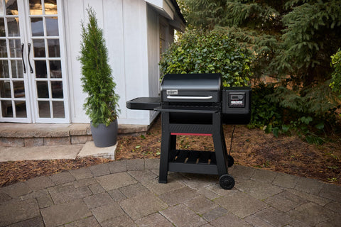 Weber Searwood 600 steel front shelf adds durable prep space.