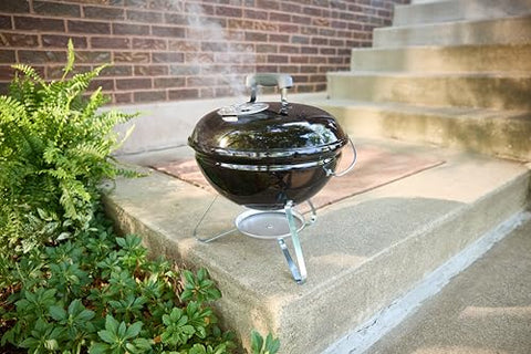 Weber Smokey Joe 14in ash catcher simplifies cleanup after grilling.