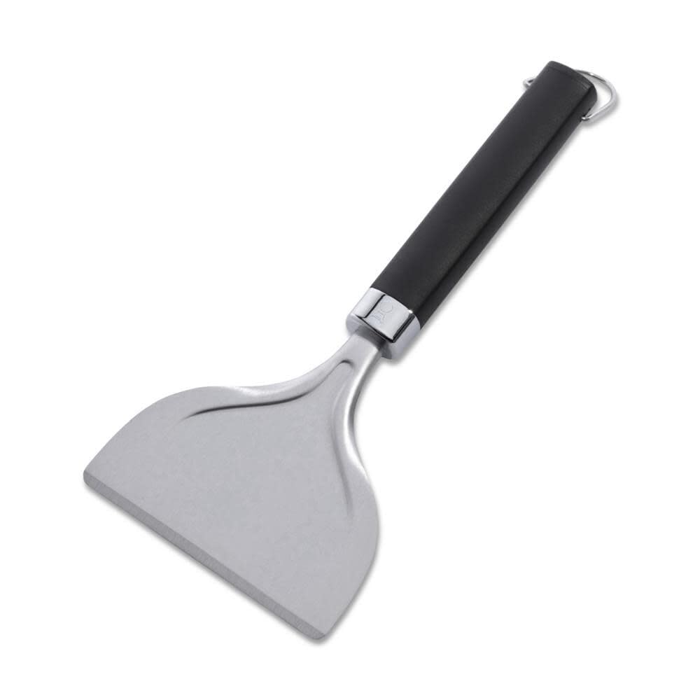 Weber stainless steel griddle scraper close-up showing durable construction for grease removal.