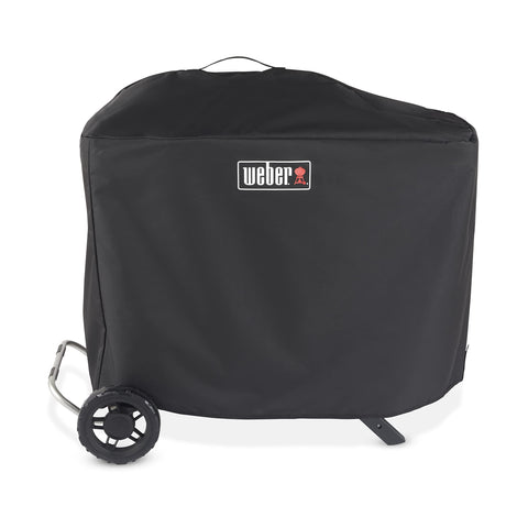 Weber Traveler Premium Cover weatherproofs the upright grill against rain and sun.