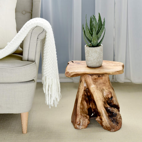 WELLAND cedar stump stool plant stand adds natural greenery focus.