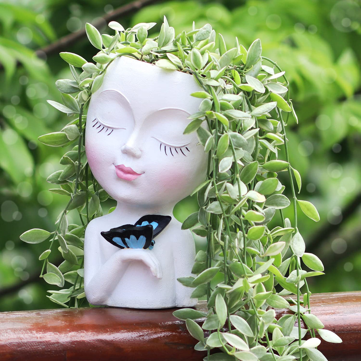 WEWEOW face planter full view showing a cute resin pot for plants.