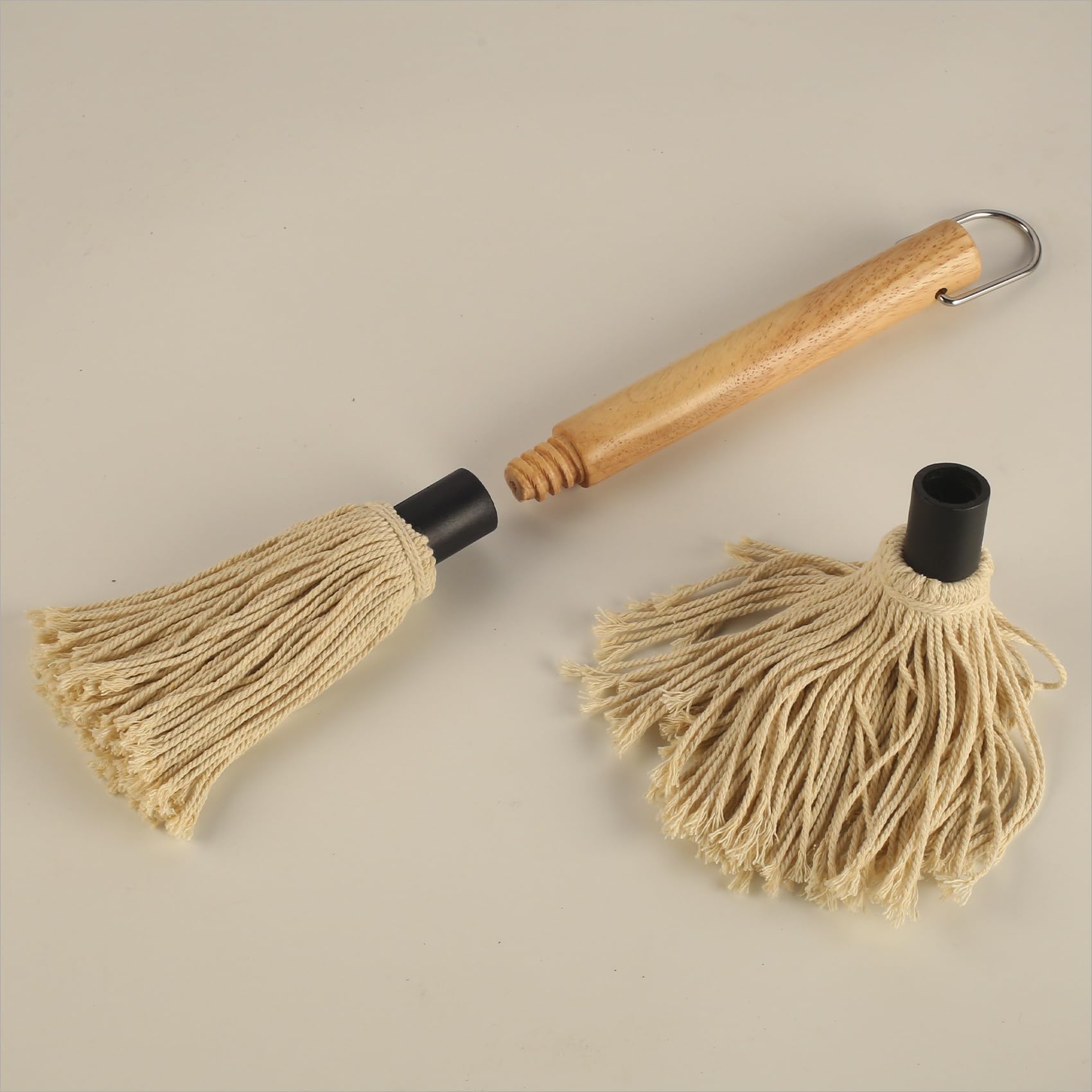WHTCHSU sauce-mop in use beside grill for basting