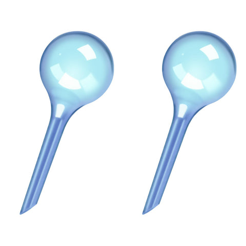 WHTCHSU small blue watering globe with clear body provides steady moisture for small plants.