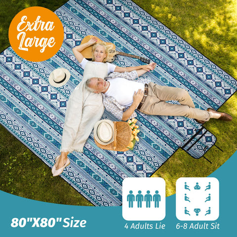 WICKERLAND blanket laid out on grass during a family picnic.