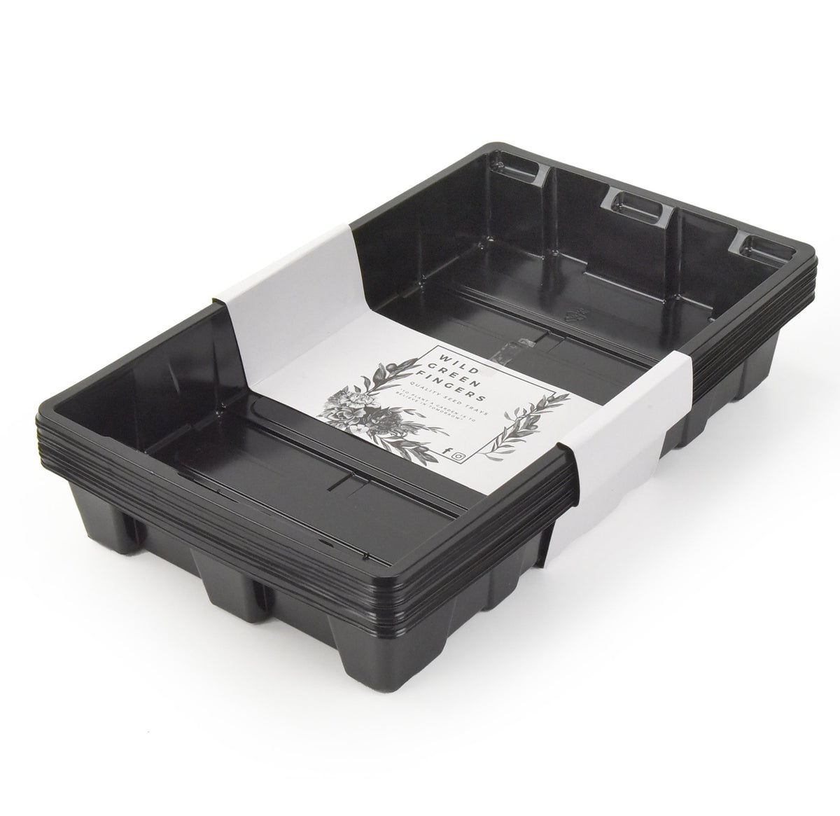 Wild Green Fingers seed-starting trays without holes keep germination organized on a sunny windowsill.