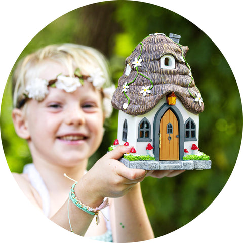 WILD PIXY Fairy House night-light in a terrarium display.