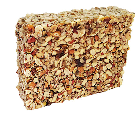 Wildlife Sciences Songbird Treats 8oz seed bars placed at a feeder for birds.