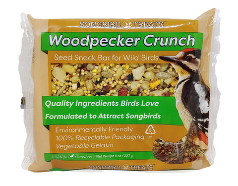 Wildlife Sciences Songbird Treats Seed Bars birds feeding on the bars in a garden.