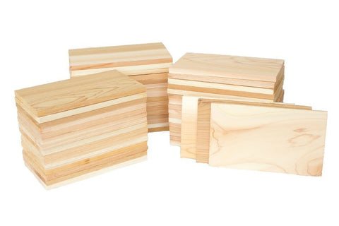 Wildwood Grilling small cedar plank stack for individual portions on grill.