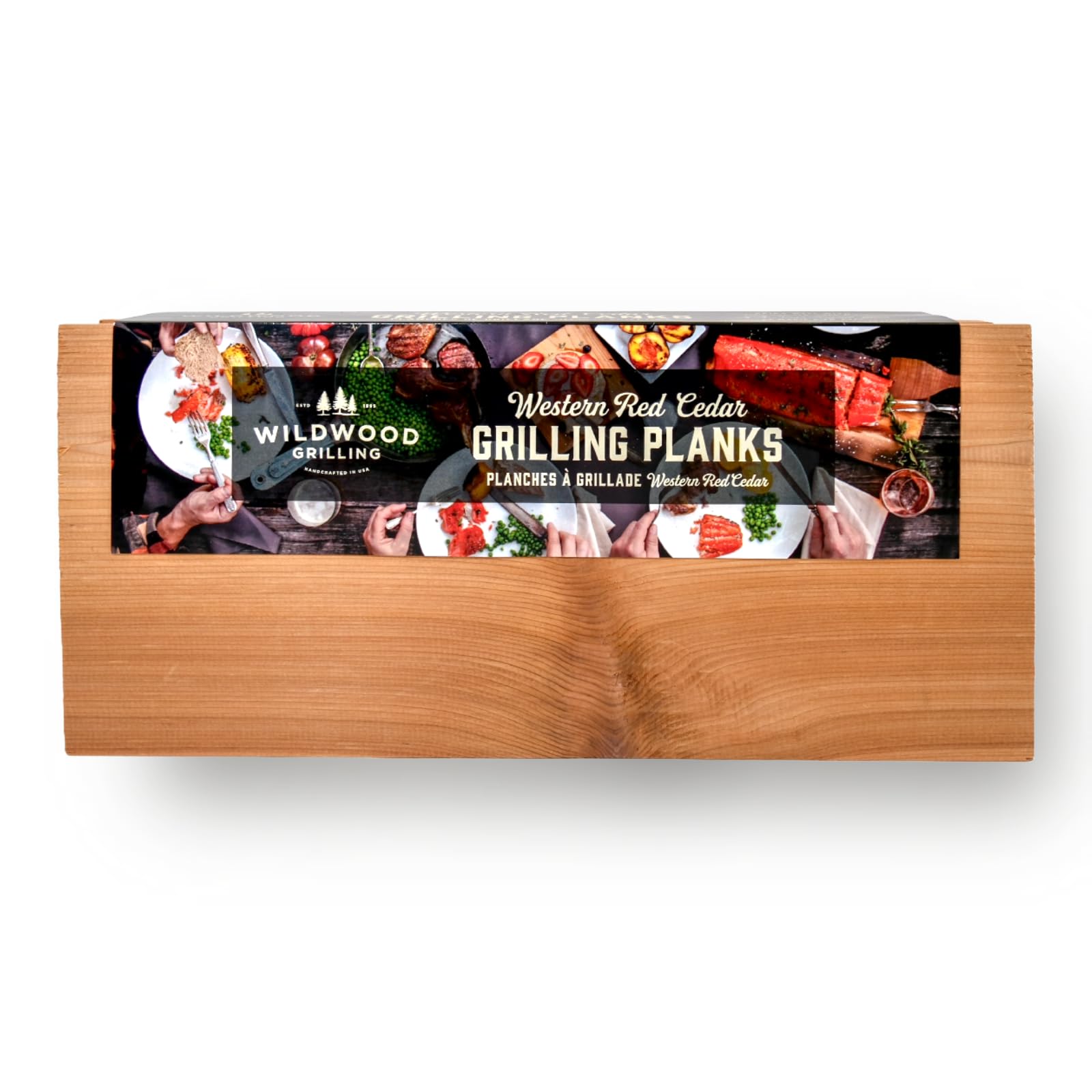 Wildwood Grilling Western Red Cedar planks on grill ready to infuse smoky flavor.