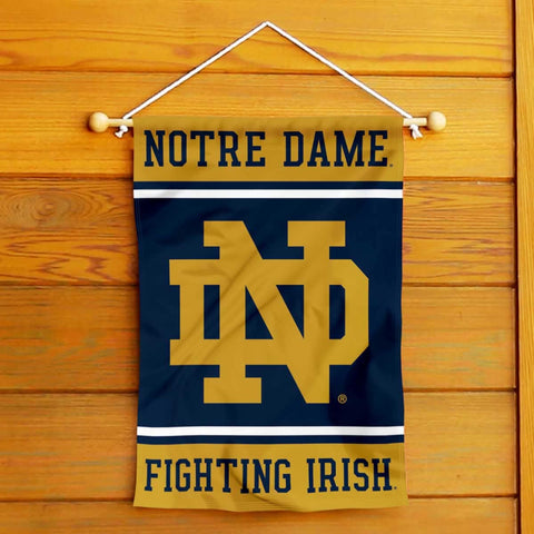 WinCraft Irish ND Logo Banner flag hung in yard on a garden stand for display